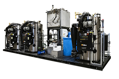 Three Fulton VSRT Boilers on steel sleds, ready for installation.